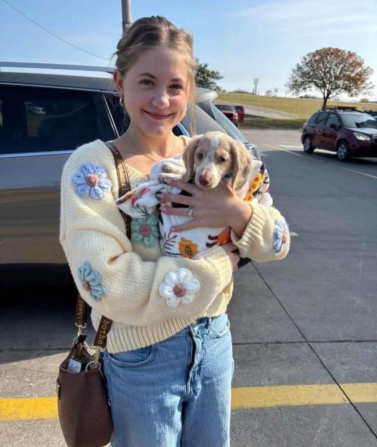 Olivia Bennett with their LongwoodLane Dachshund